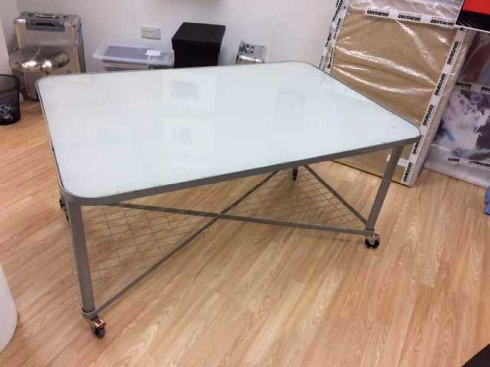 Industrial Desks on rollers with glass top in london